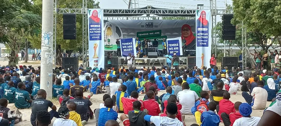 Audience gathered in front of an outdoor public event stage